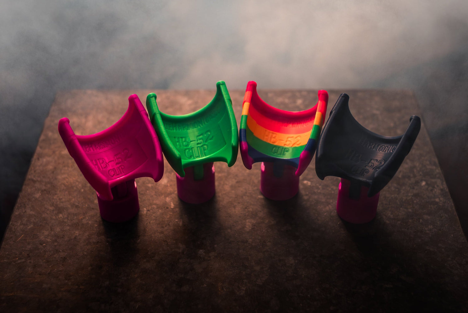 Multiple colours of microphone clips for attachning the HB-52 harmonica to a mic stand.